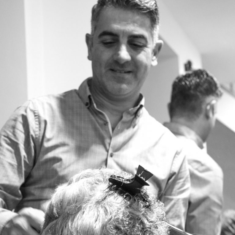 Man cutting someone's hair